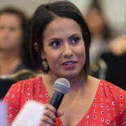 Lupus warrior Audrey Ayala speaking into a microphone